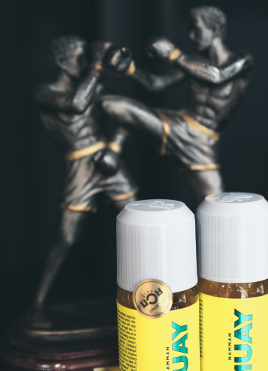 Closeup of Muay Thai oil, with a trophy in the background in the Saint Muay Thai Gym